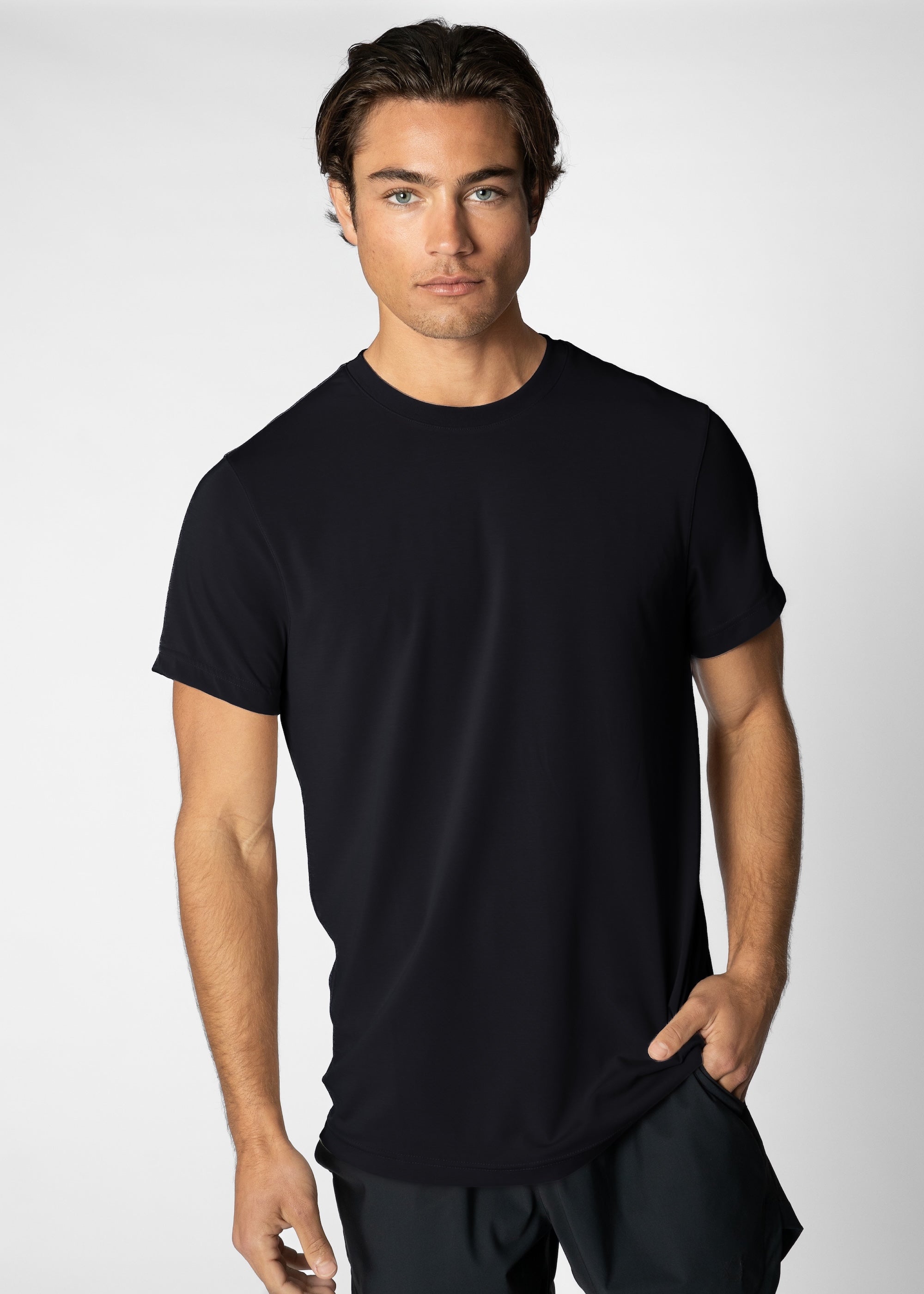 Man wearing a black t-shirt against a plain background #color_black #model_A