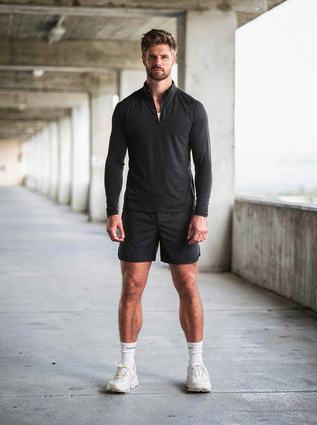 The Haus Super Bundle — five piece set worn in a concrete breezeway